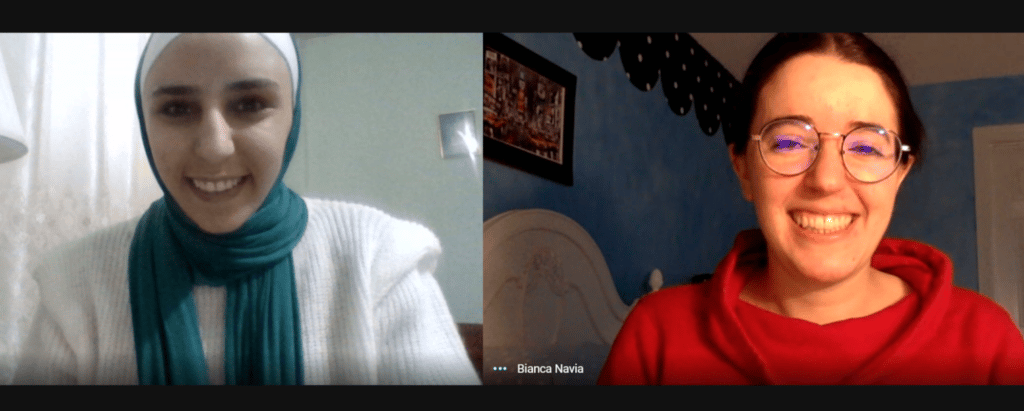 The author laughs with a woman wearing a hijab on a Zoom call