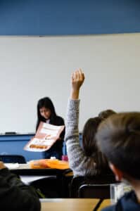 student presenting to classmates 