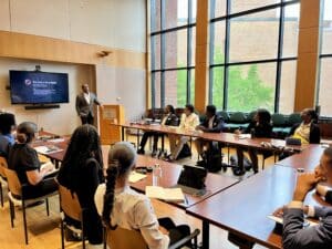 Group of students attending a seminar in a classroom at Georgetown's Security Studies Summer Institute for HBCU Students.