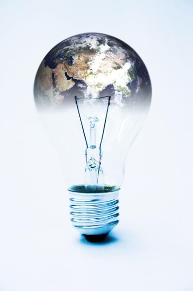 Light bulb & planet earth (courtesy of NASA) global power concept - image is supposed to be quite stark & contrasty